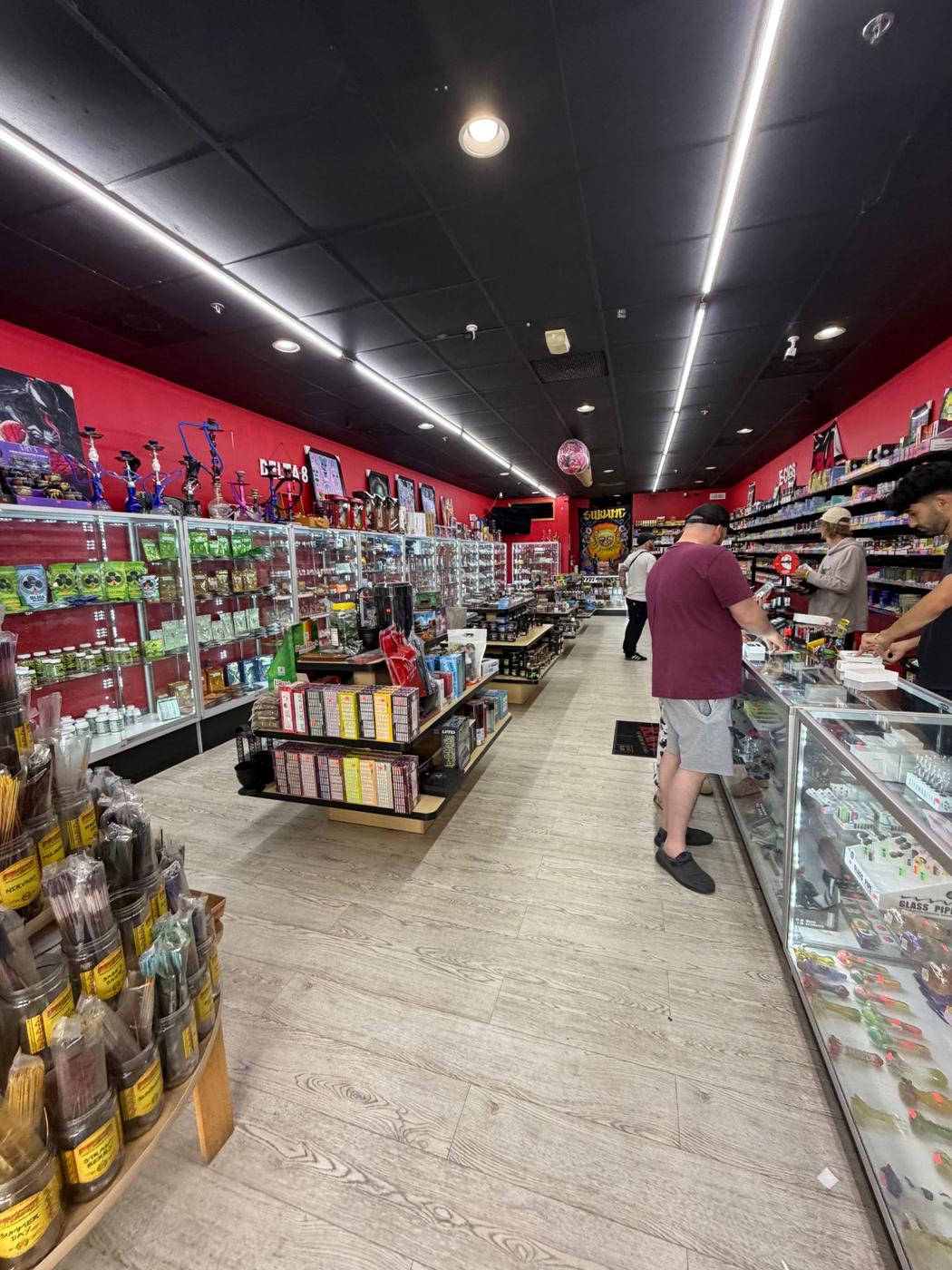 The main aisle at Supreme Smoke And Vape, displays down the middle.
