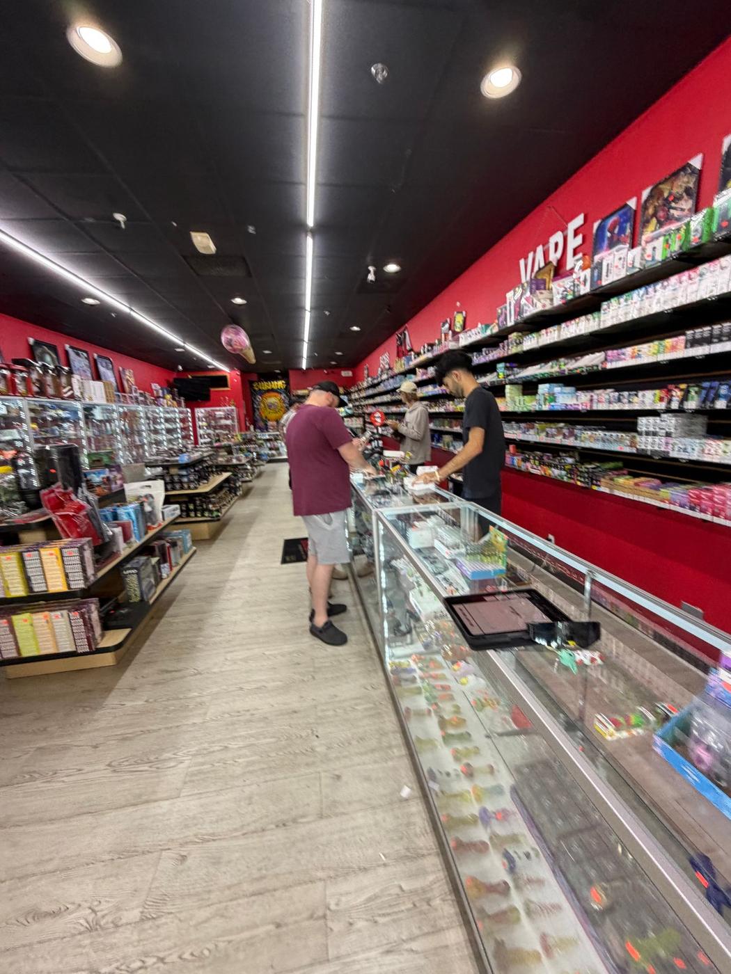 The vape wall behind the counter at Supreme Smoke And Vape.